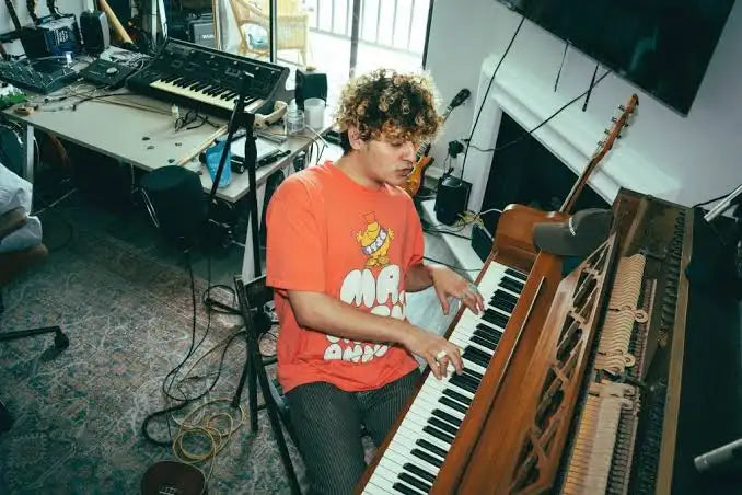 Dolo Tonight playing piano in a studio